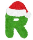 3D Ã¢â¬ÅGreen wool fur feather letterÃ¢â¬Â creative decorative with Red Christmas hat, Character R isolated in white background Royalty Free Stock Photo